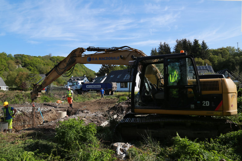 13t CAT excavator with a lorry in the foreground